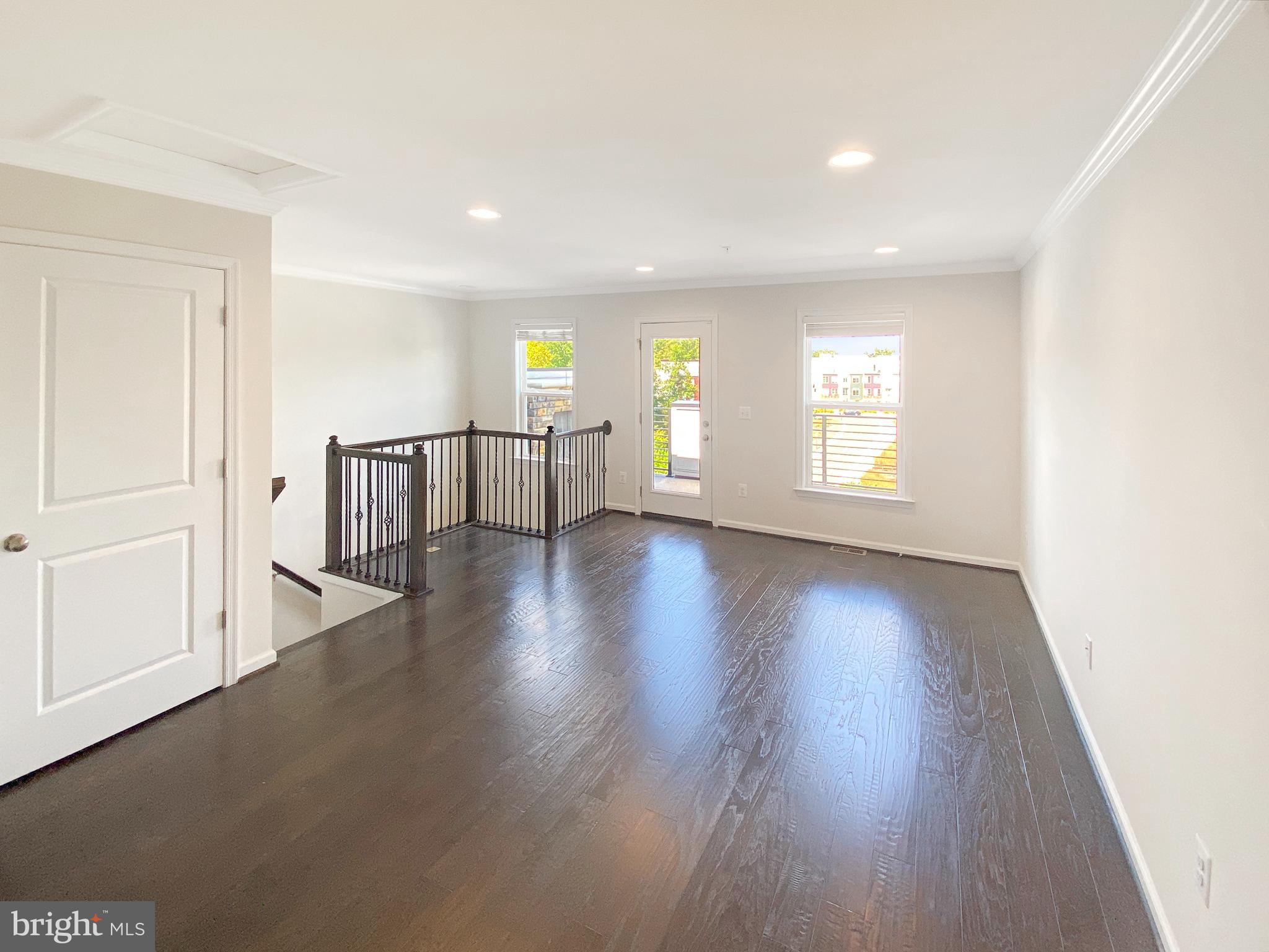 4967 Lakeside Crossing Chantilly, VA 20151 - Photo 32 of 45 a view of an empty room with a window and wooden floor