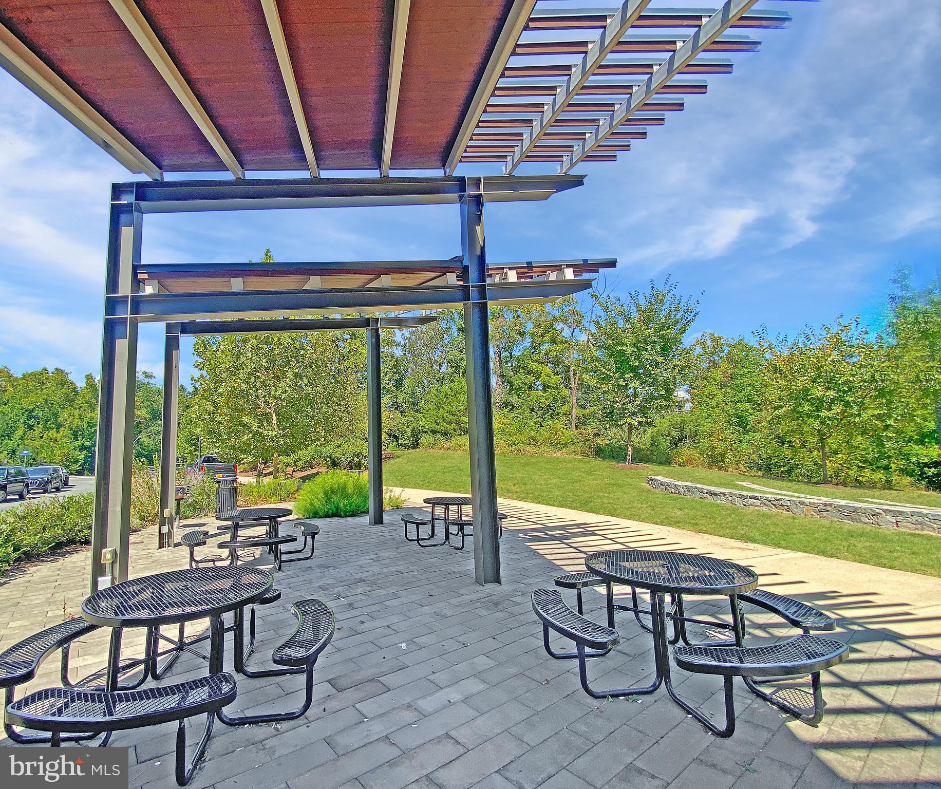 4967 Lakeside Crossing Chantilly, VA 20151 - Photo 42 of 45 a view of a swimming pool with a table and chairs in patio