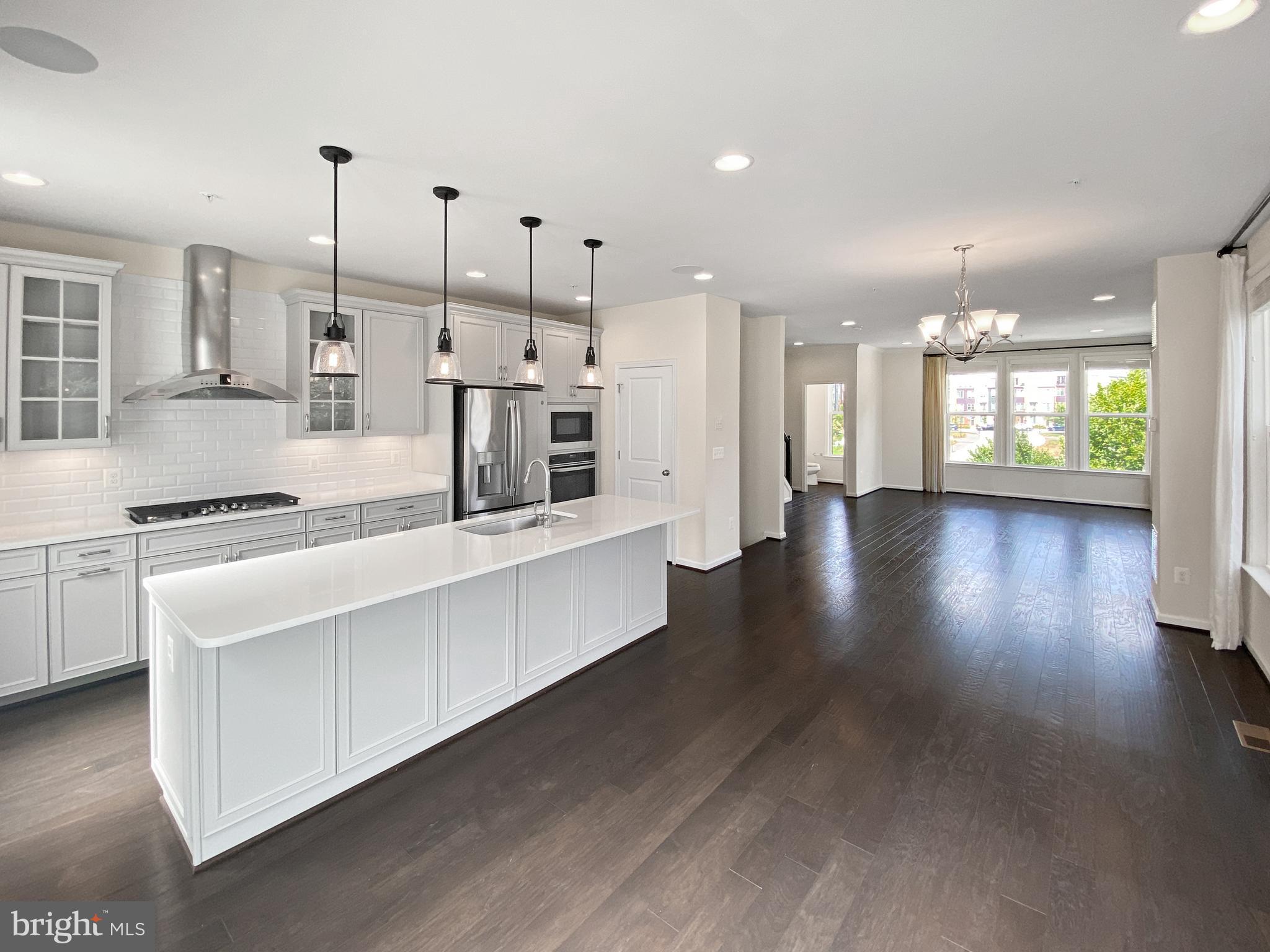 4967 Lakeside Crossing Chantilly, VA 20151 - Photo 4 of 45 a large kitchen with lots of counter space wooden floor and appliances