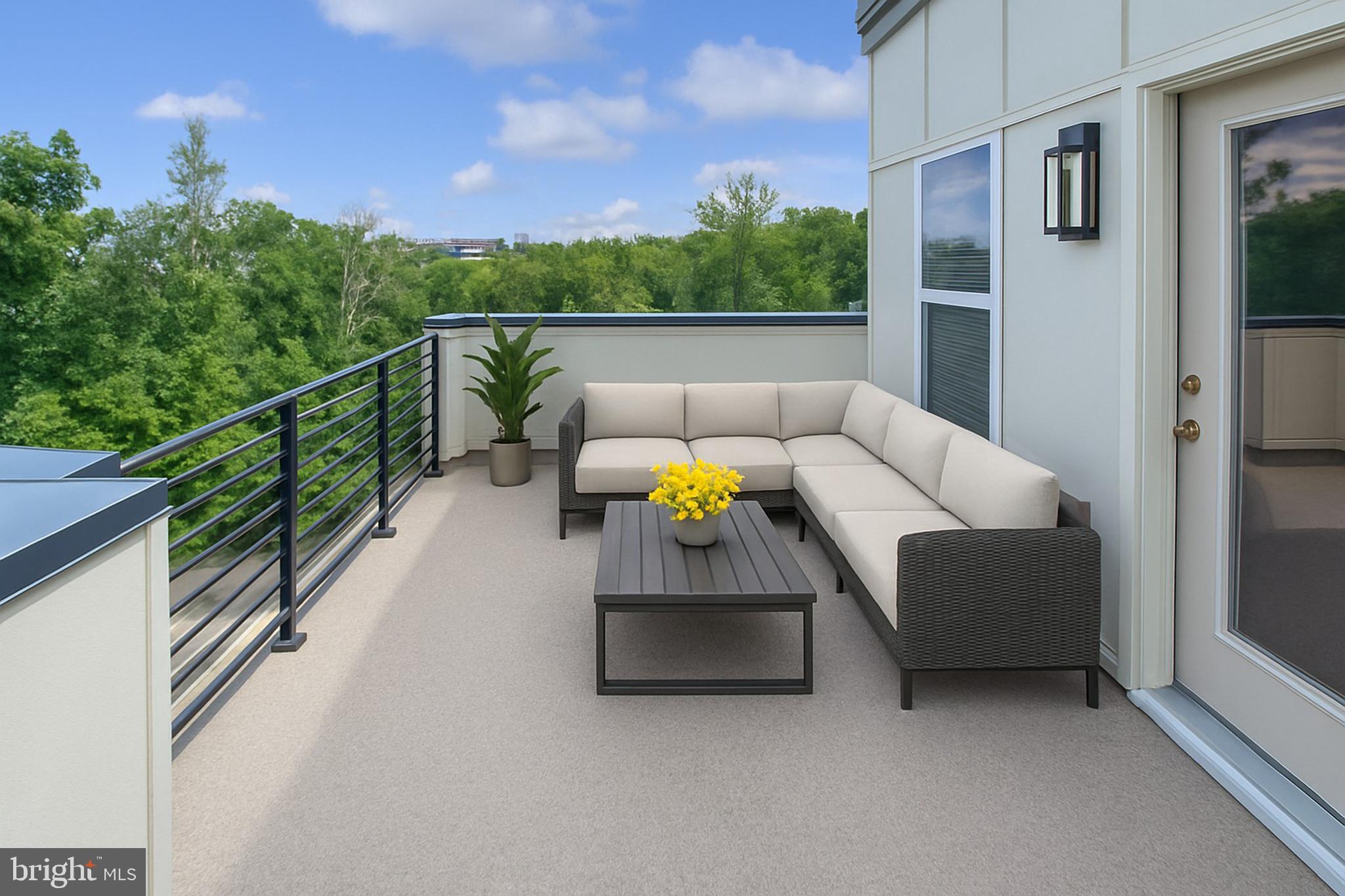 4967 Lakeside Crossing Chantilly, VA 20151 - Photo 9 of 45 a balcony with furniture and a potted plant