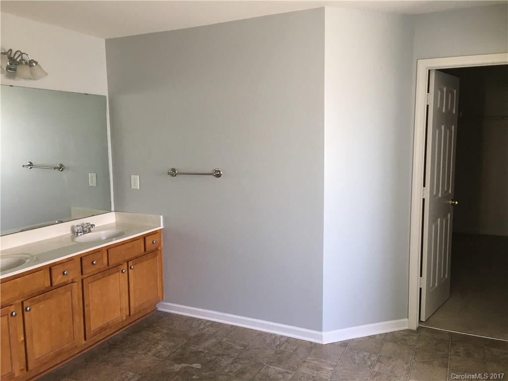 1011 Rural Farm Road Indian Trail, NC 28079 - Photo 12 of 24 a utility room with cabinets washer and dryer