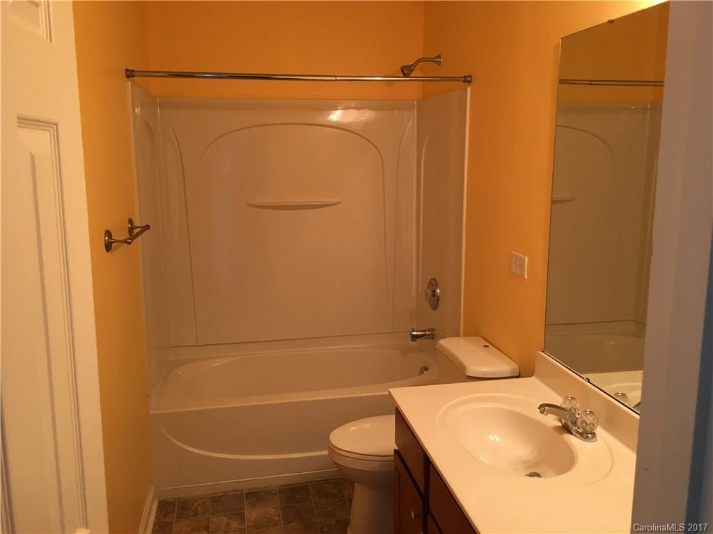 1011 Rural Farm Road Indian Trail, NC 28079 - Photo 21 of 24 a bathroom with a sink a toilet and shower