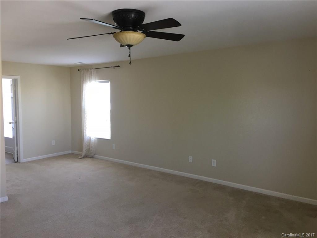 1011 Rural Farm Road Indian Trail, NC 28079 - Photo 10 of 24 an empty room with a window and a fan