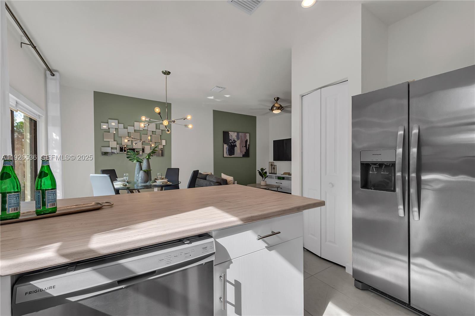 12980 Southwest 233rd Terrace Homestead, FL 33032 - Photo 15 of 28 a kitchen with a sink and refrigerator