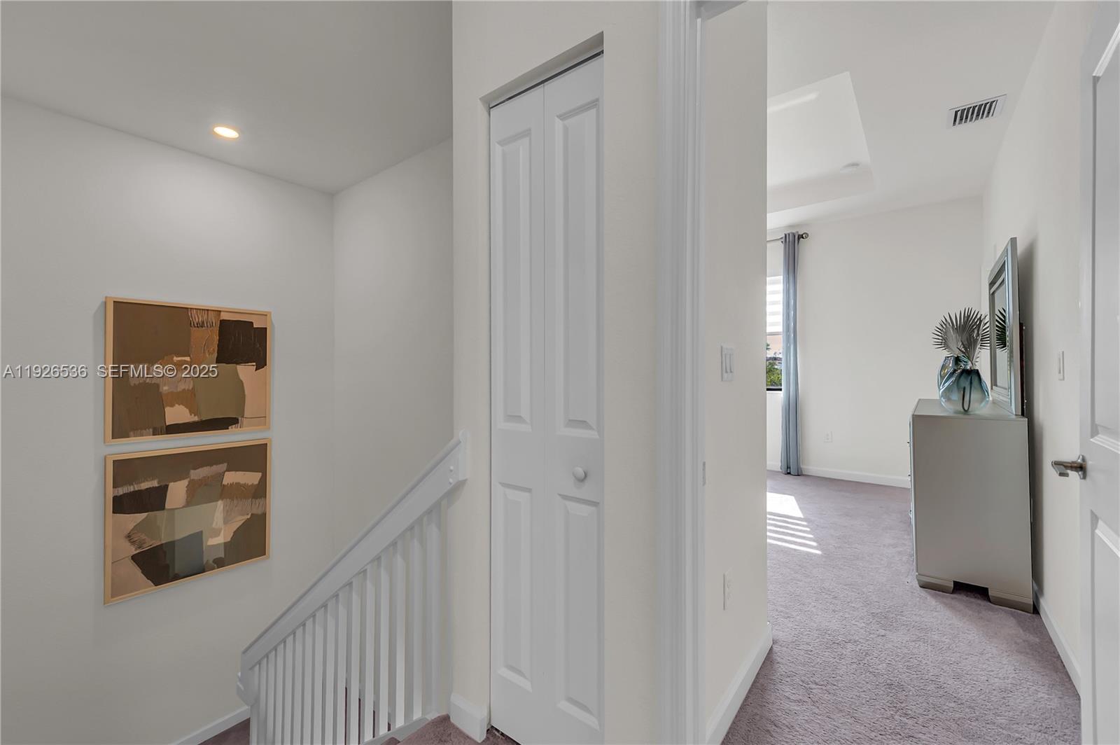12980 Southwest 233rd Terrace Homestead, FL 33032 - Photo 16 of 28 a view of a hallway with closet and cabinet