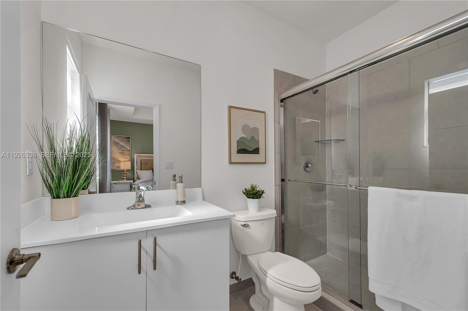 12980 Southwest 233rd Terrace Homestead, FL 33032 - Photo 20 of 28 a bathroom with a sink a toilet and shower