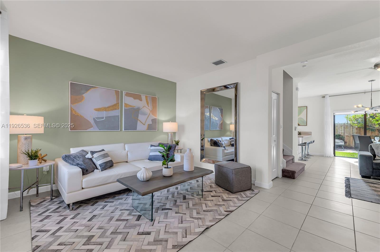 12980 Southwest 233rd Terrace Homestead, FL 33032 - Photo 2 of 28 a living room with furniture and a couch