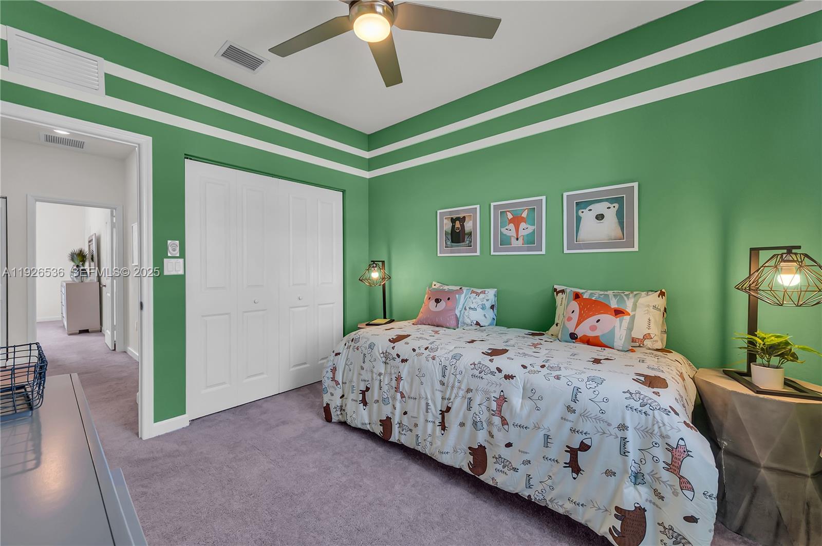 12980 Southwest 233rd Terrace Homestead, FL 33032 - Photo 26 of 28 a bedroom with a bed and a chandelier