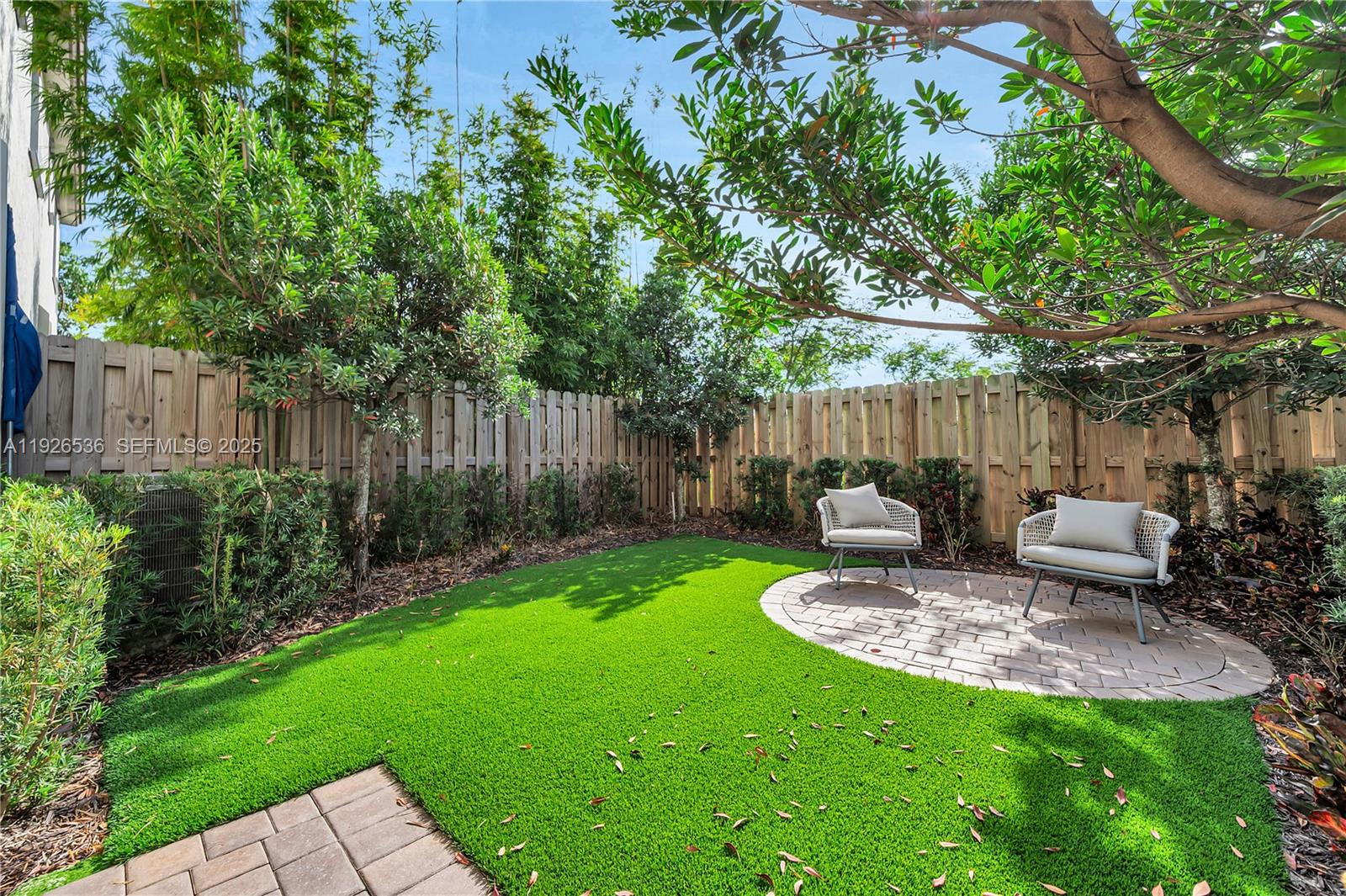 12980 Southwest 233rd Terrace Homestead, FL 33032 - Photo 27 of 28 a view of a chair and table in backyard of the house