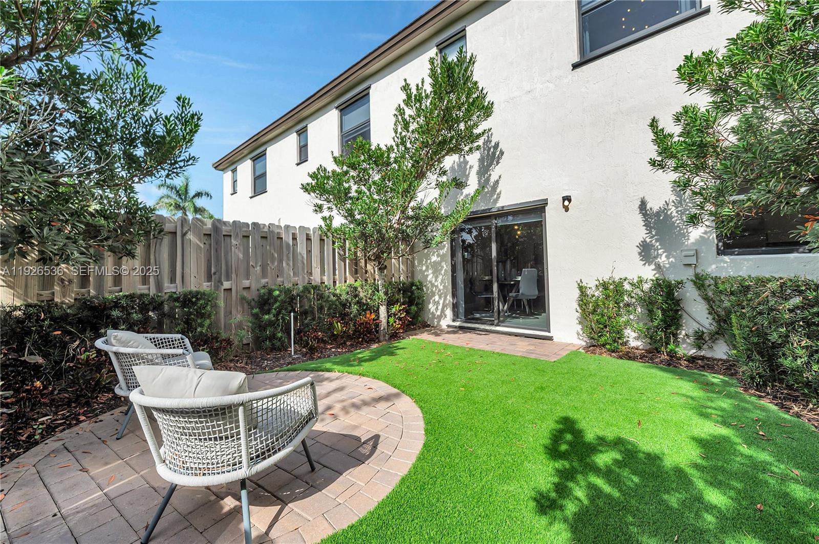 12980 Southwest 233rd Terrace Homestead, FL 33032 - Photo 28 of 28 a view of a chair and table in backyard of the house