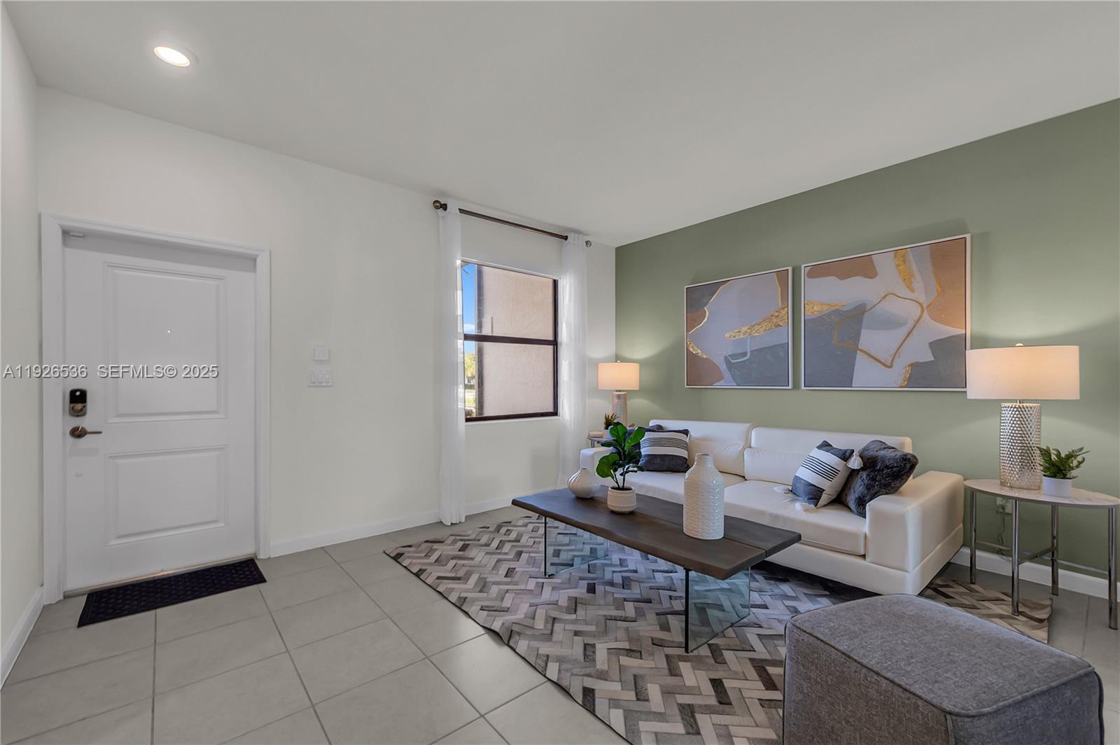 12980 Southwest 233rd Terrace Homestead, FL 33032 - Photo 4 of 28 a living room with furniture and window