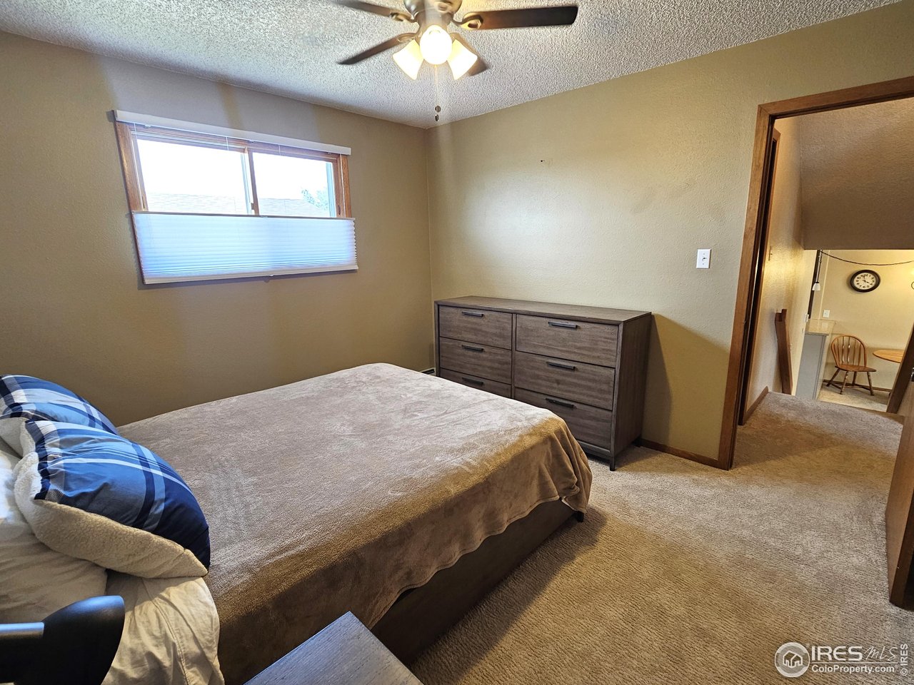 570 California Street Sterling, CO 80751 - Photo 18 of 41 a bedroom with a bed and window