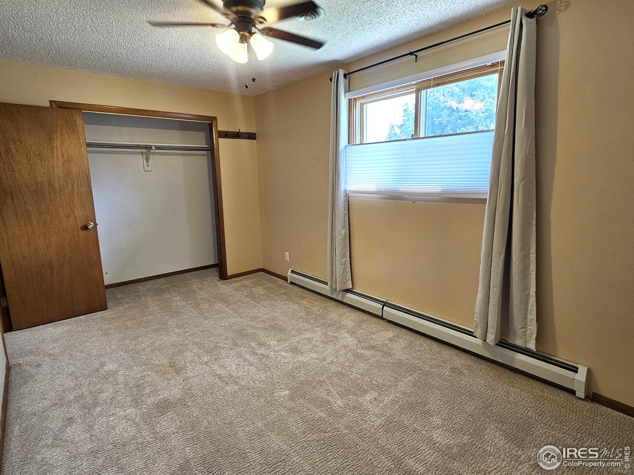 570 California Street Sterling, CO 80751 - Photo 21 of 41 an empty room with closet area