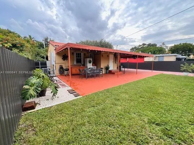 a view of a backyard with swimming pool