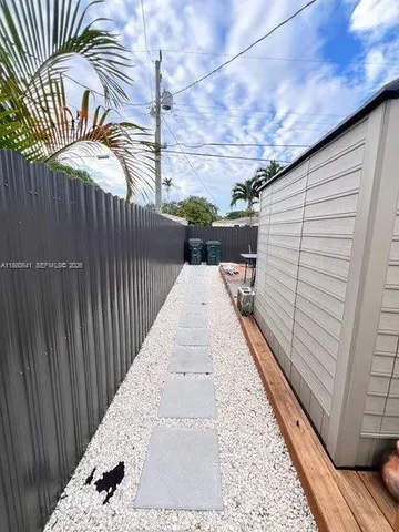 a view of a backyard with sitting area