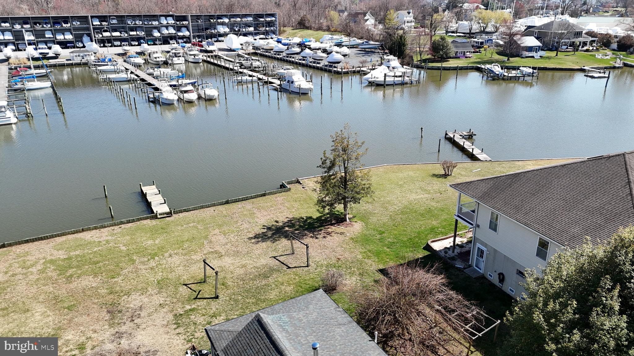 109 Hughes Shore Road Baltimore, MD 21220 - Photo 13 of 43 an aerial view of residential houses with outdoor space and lake view