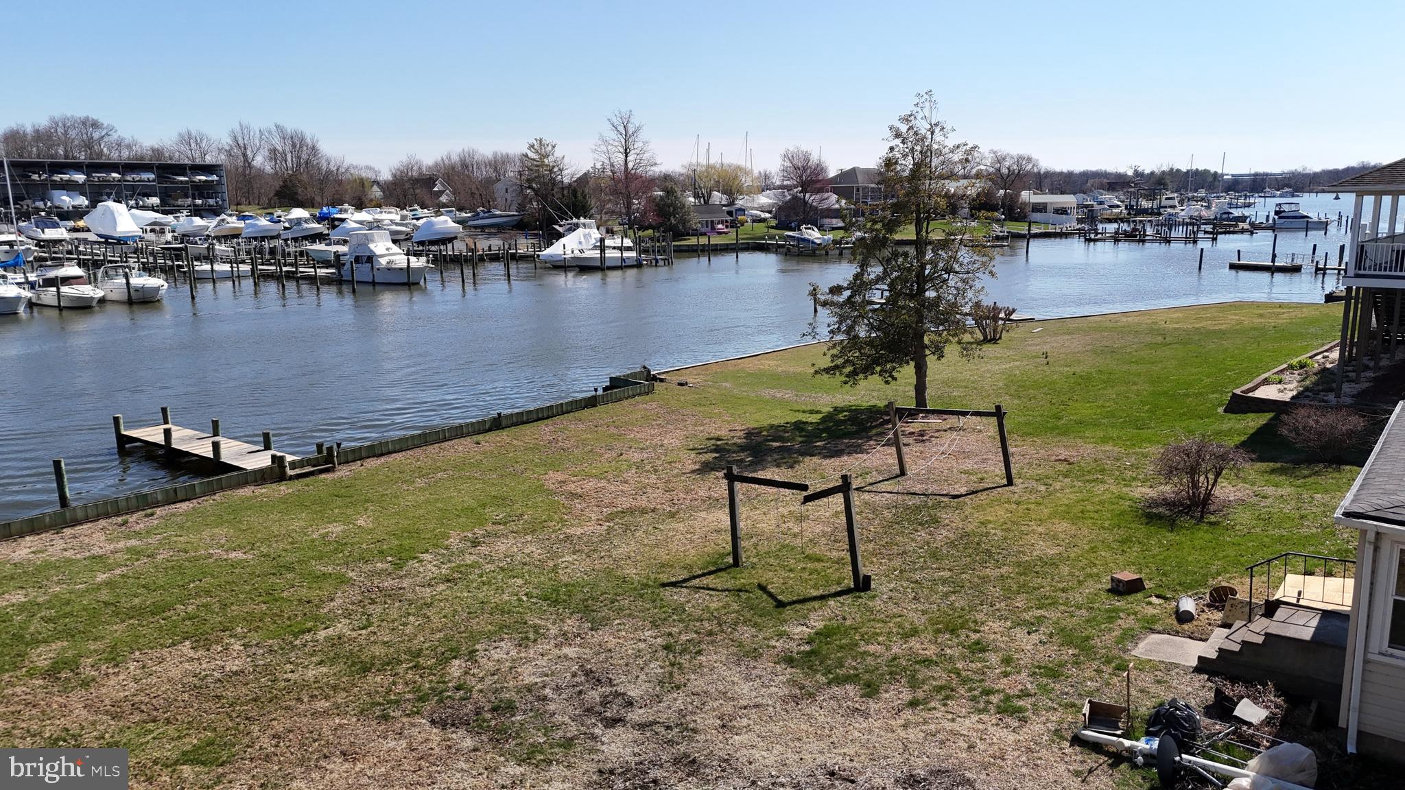 109 Hughes Shore Road Baltimore, MD 21220 - Photo 17 of 43 a view of a lake with boats and trees in the background