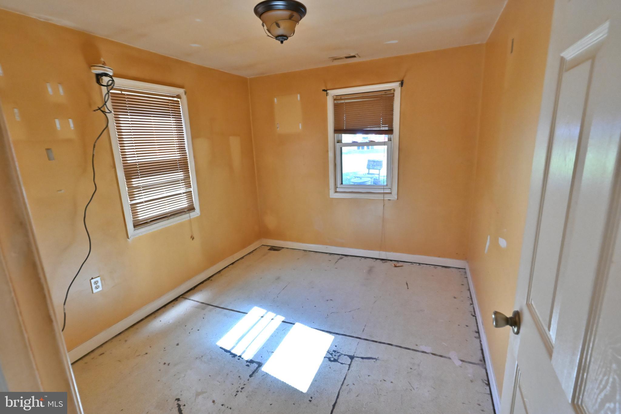 109 Hughes Shore Road Baltimore, MD 21220 - Photo 25 of 43 a view of an empty room and window