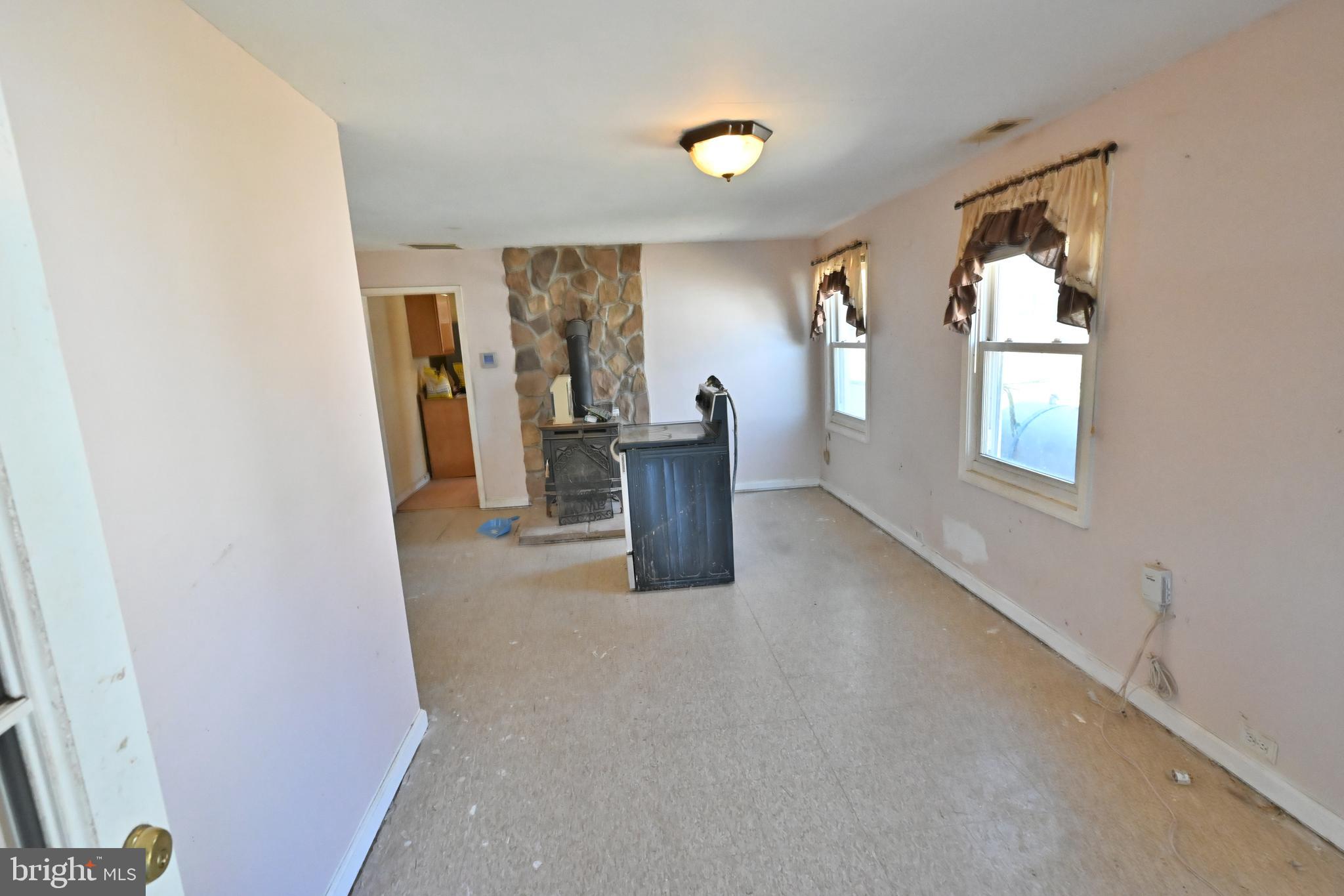 109 Hughes Shore Road Baltimore, MD 21220 - Photo 28 of 43 a view of a living room with windows