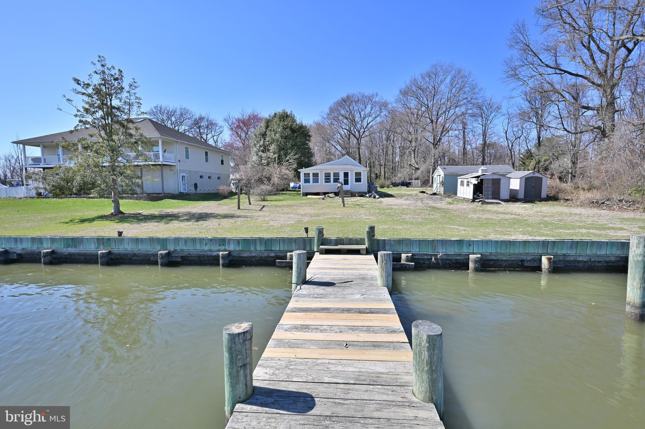 109 Hughes Shore Road Baltimore, MD 21220 - Photo 31 of 43 a view of a house with pool and a yard
