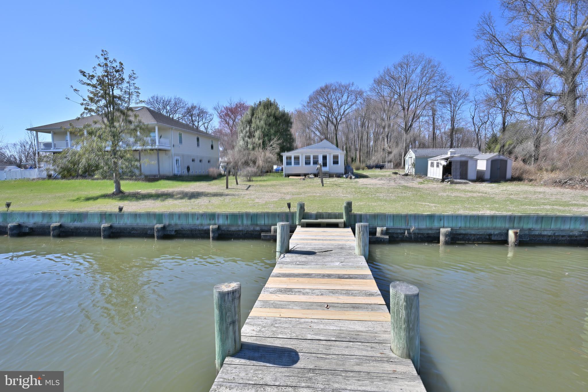 109 Hughes Shore Road Baltimore, MD 21220 - Photo 32 of 43 a view of a lake with a garden
