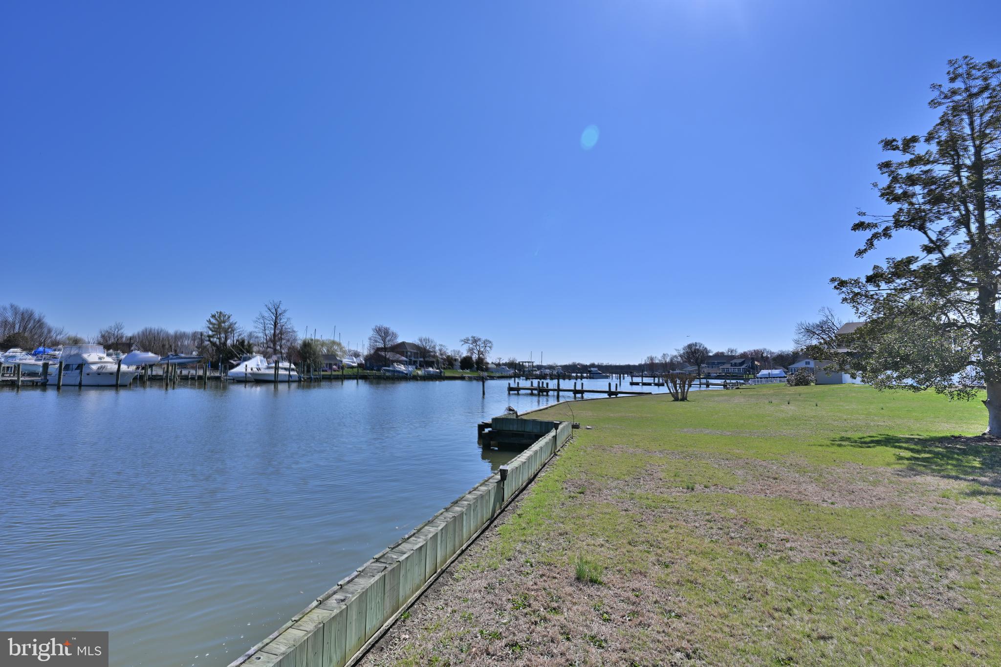 109 Hughes Shore Road Baltimore, MD 21220 - Photo 36 of 43 a view of a lake with houses in the back