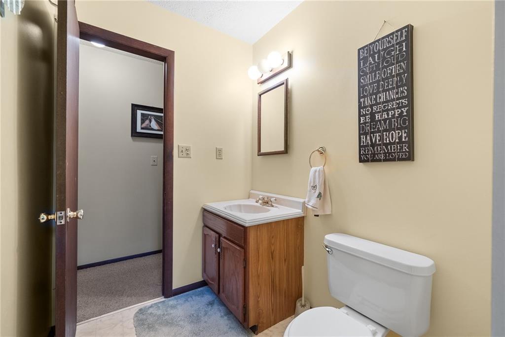 1010 Bonniebrook Road Butler, PA 16002 - Photo 20 of 48 a bathroom with a toilet a sink and mirror