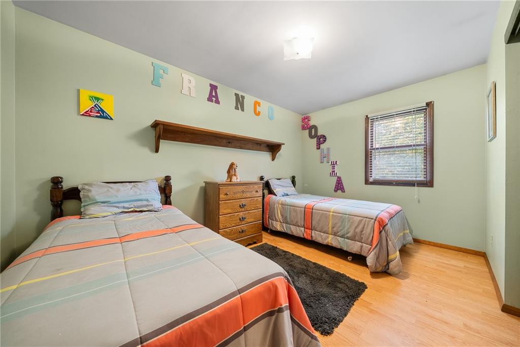 1010 Bonniebrook Road Butler, PA 16002 - Photo 23 of 48 a bedroom with a bed and painting on the wall