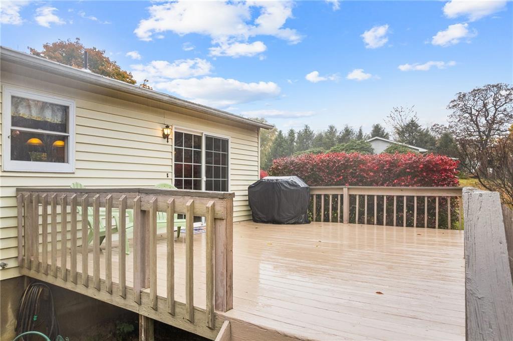 1010 Bonniebrook Road Butler, PA 16002 - Photo 37 of 48 a view of a chair and table on the wooden deck