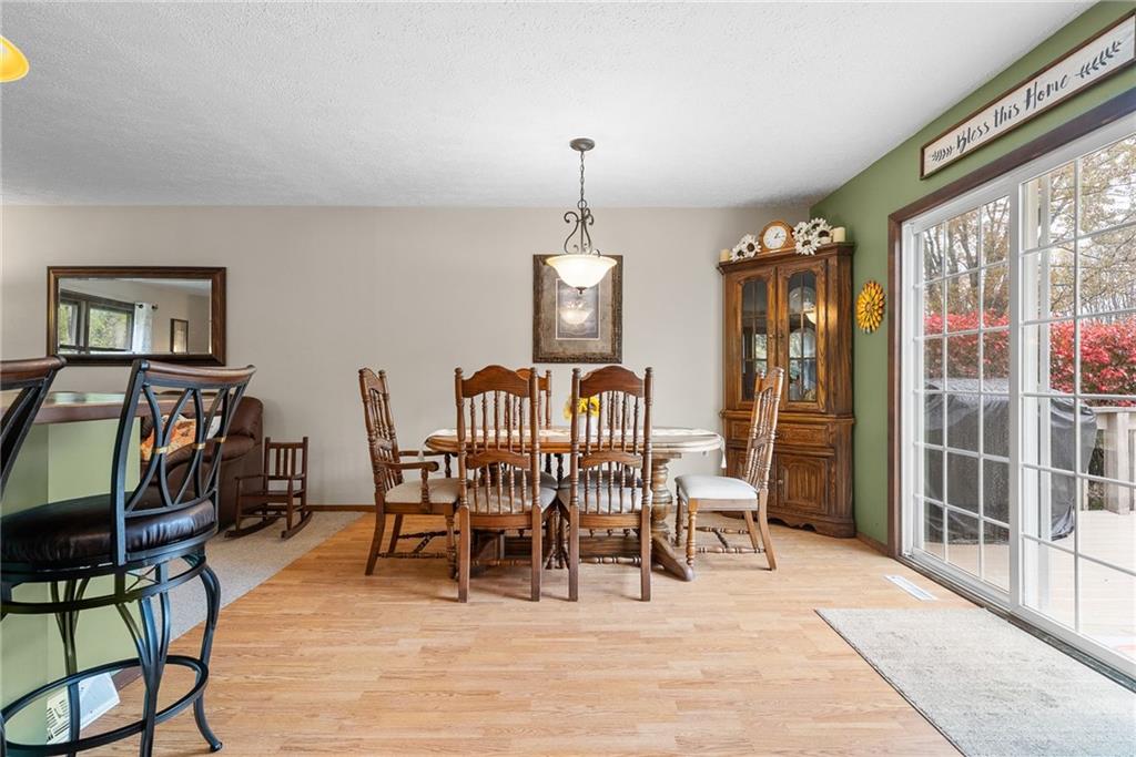 1010 Bonniebrook Road Butler, PA 16002 - Photo 9 of 48 a dining room with furniture a chandelier and wooden floor