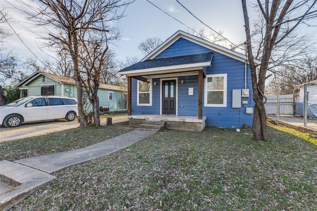 4010 Copeland Street Dallas, TX 75210 - Photo 2 of 23 a front view of a house with a yard