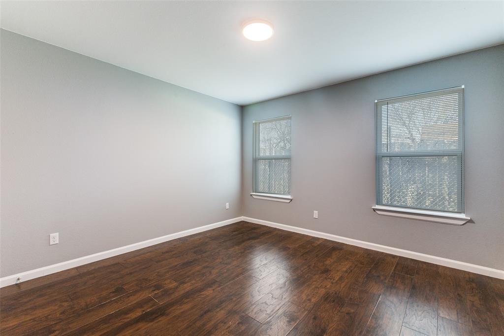 4010 Copeland Street Dallas, TX 75210 - Photo 22 of 23 an empty room with wooden floor and windows