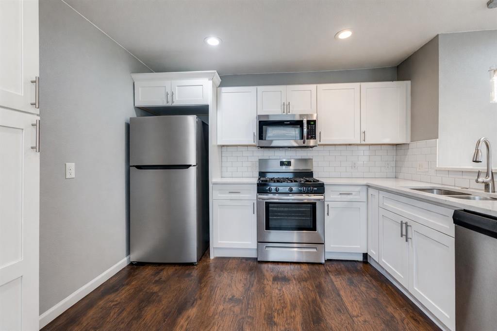 4010 Copeland Street Dallas, TX 75210 - Photo 8 of 23 a kitchen with stainless steel appliances a refrigerator sink and microwave
