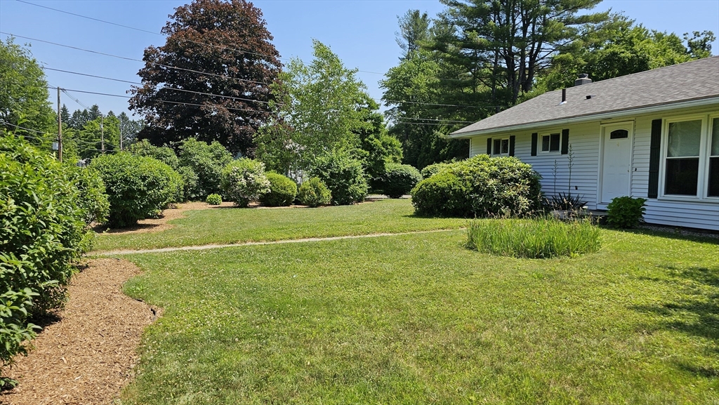 298 Ryan Road Northampton, MA 01062 - Photo 2 of 28 a view of a house with a yard and potted plants