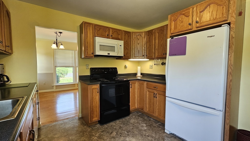 298 Ryan Road Northampton, MA 01062 - Photo 7 of 28 a kitchen with stainless steel appliances granite countertop a refrigerator and a stove