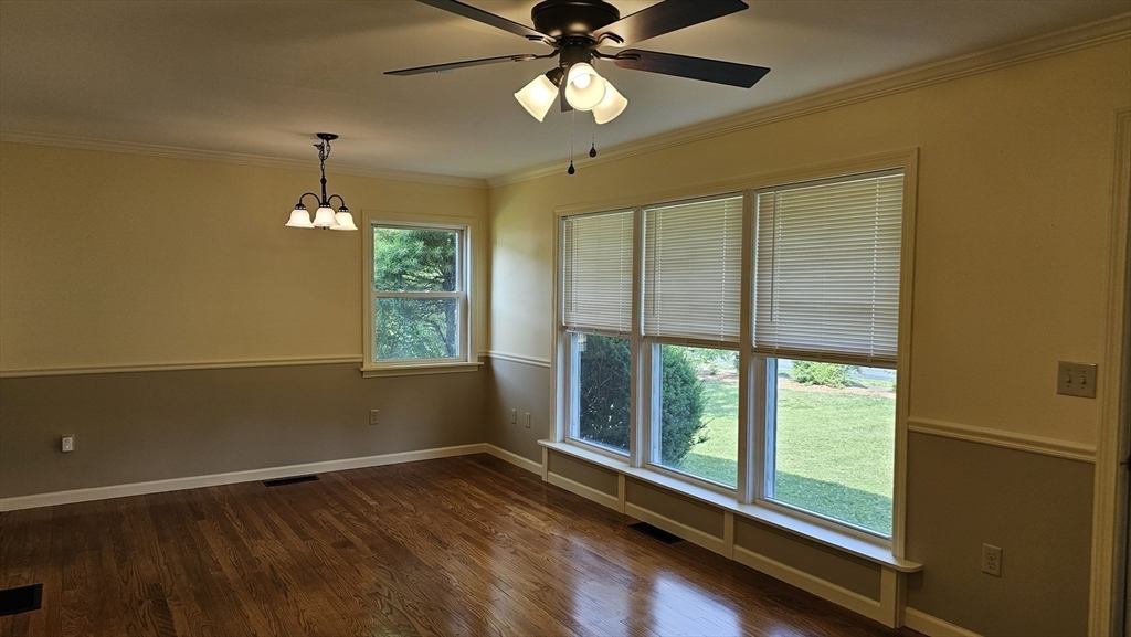 298 Ryan Road Northampton, MA 01062 - Photo 9 of 28 a view of an empty room with window chandelier fan and fire place