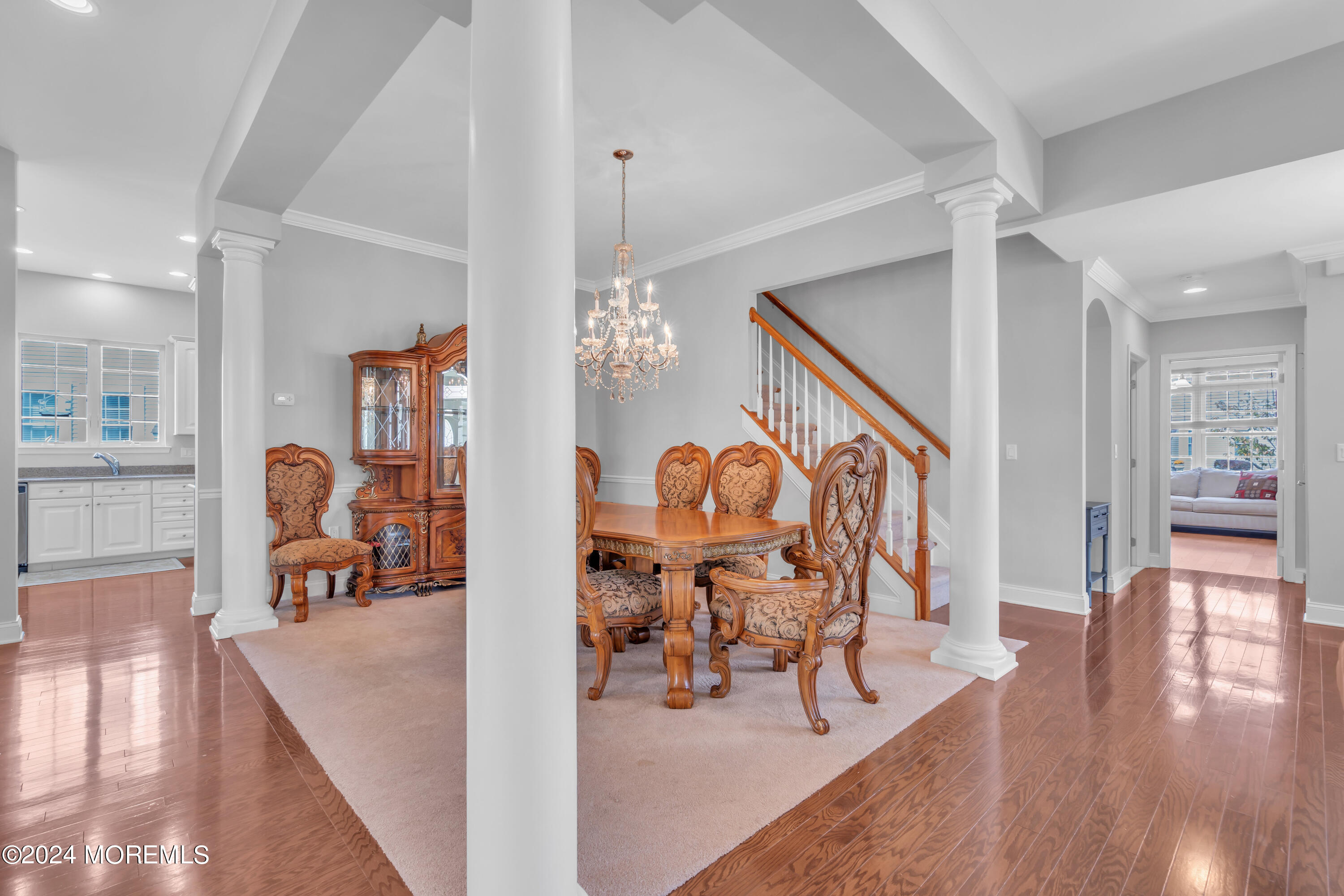 49 Eagleswood Drive Waretown, NJ 08758 - Photo 11 of 51 a view of a livingroom and dining room with furniture wooden floor and a chandelier