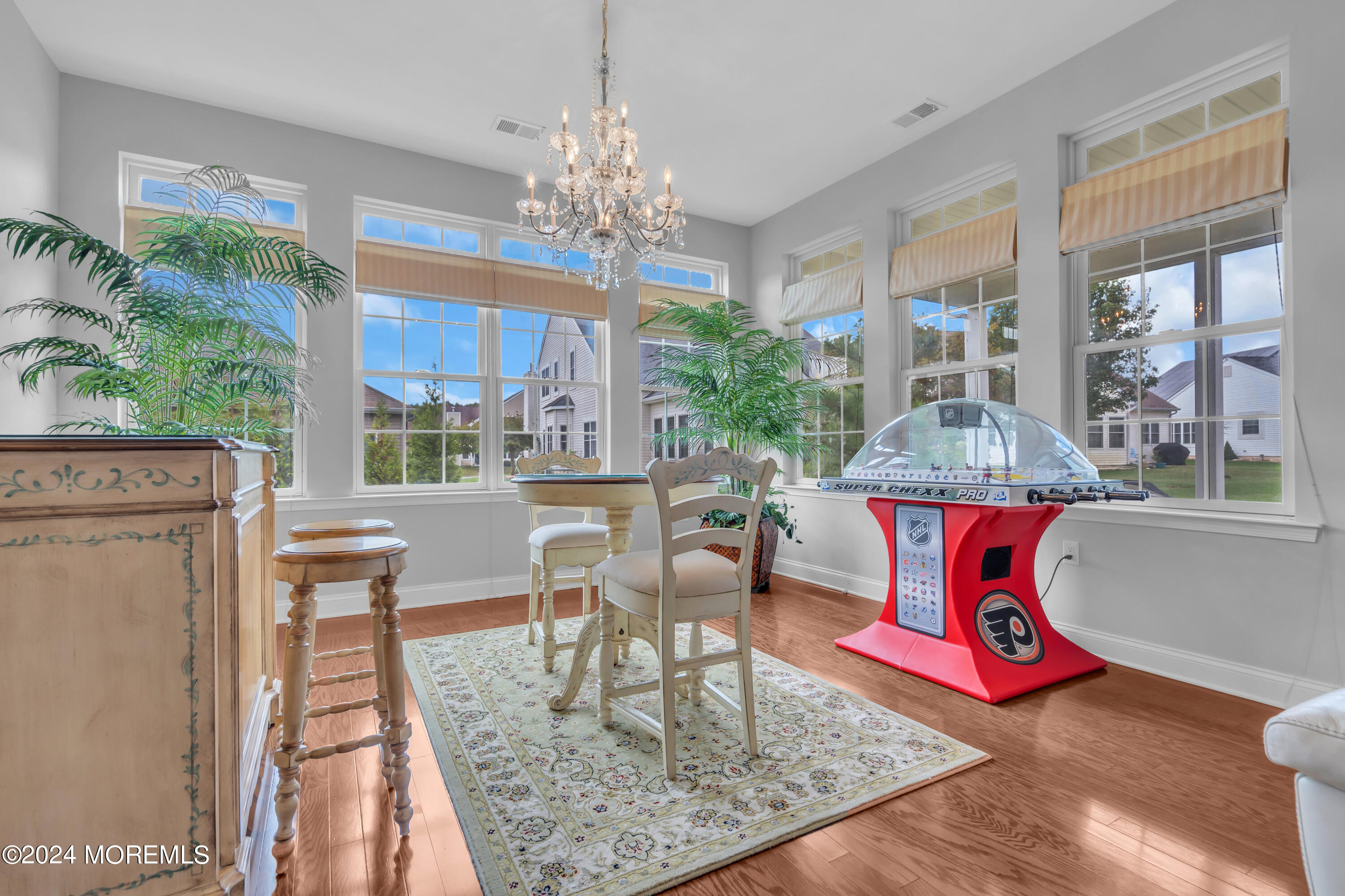 49 Eagleswood Drive Waretown, NJ 08758 - Photo 18 of 51 a view of a dining room with furniture a chandelier and wooden floor
