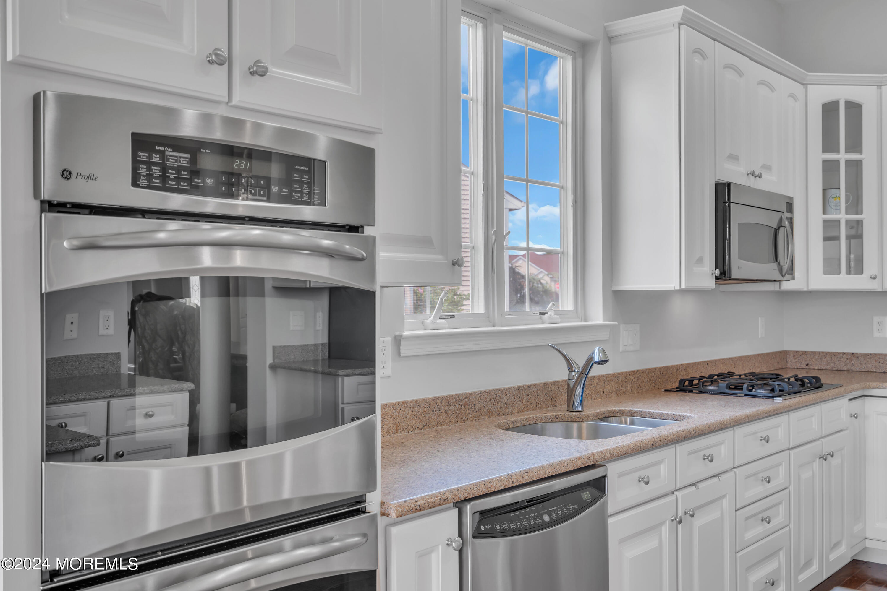 49 Eagleswood Drive Waretown, NJ 08758 - Photo 26 of 51 a kitchen with stainless steel appliances a sink stove and cabinets