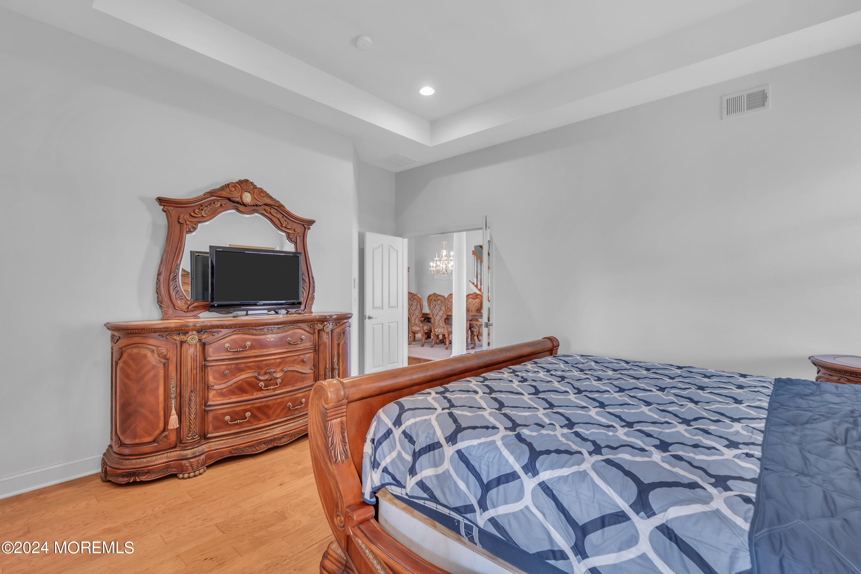 49 Eagleswood Drive Waretown, NJ 08758 - Photo 32 of 51 a bedroom with a bed and flat screen tv