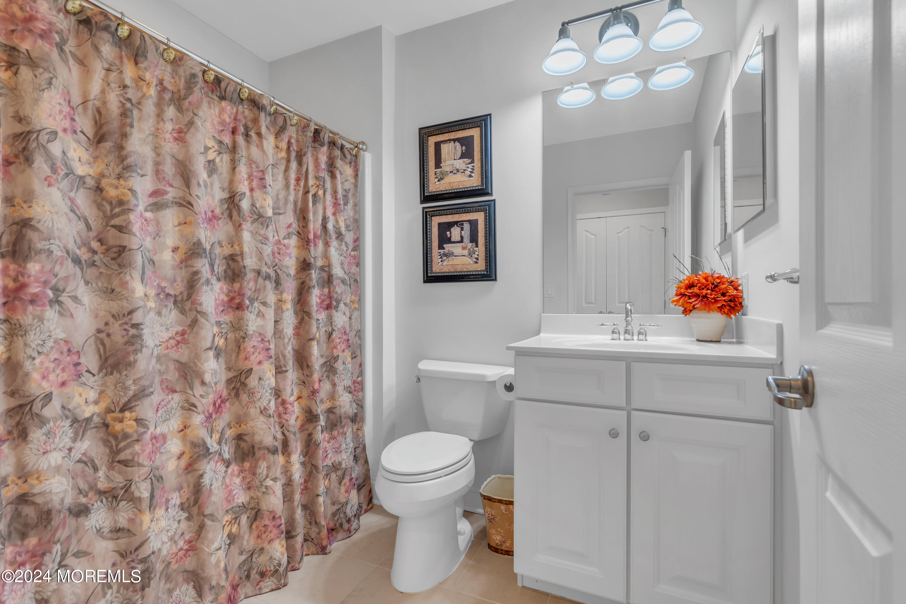 49 Eagleswood Drive Waretown, NJ 08758 - Photo 37 of 51 a bathroom with a sink toilet and vanity