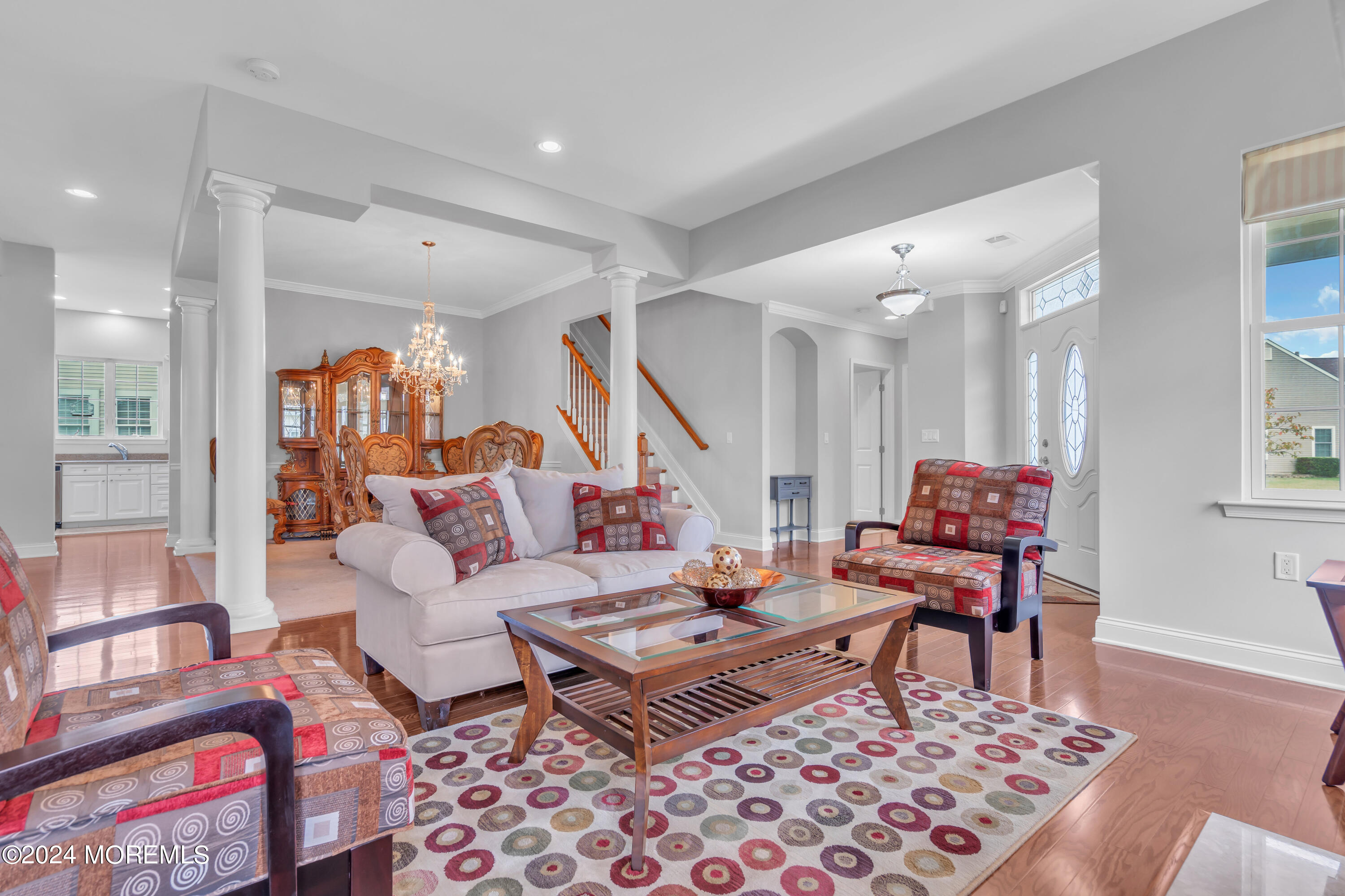 49 Eagleswood Drive Waretown, NJ 08758 - Photo 9 of 51 a living room with furniture a rug and a table