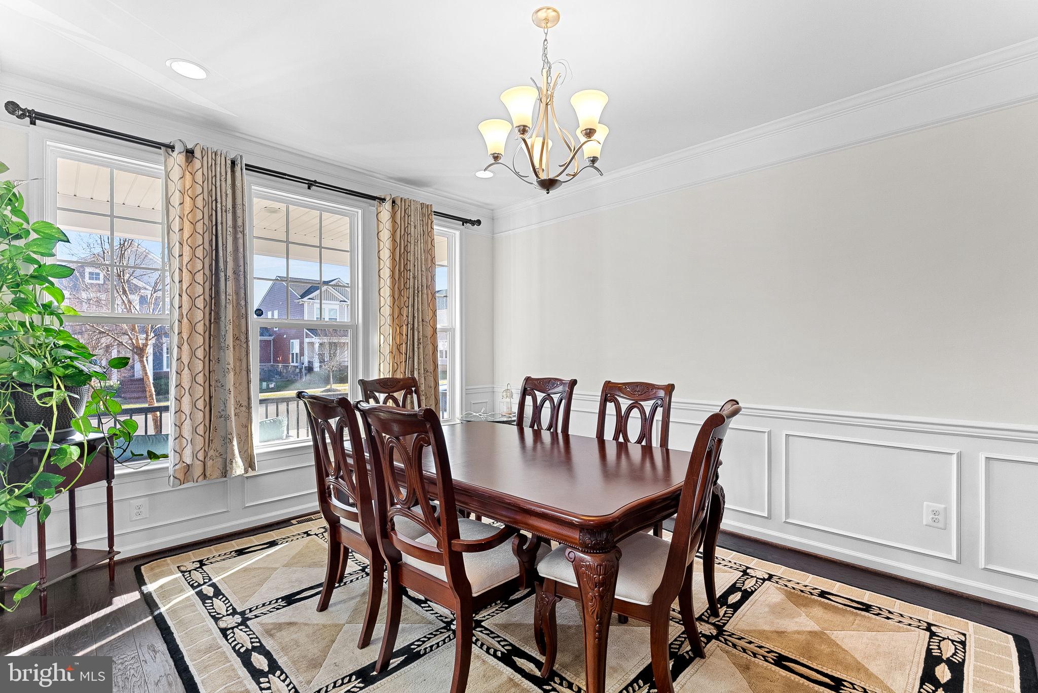 1010 Themis Street Southeast Leesburg, VA 20175 - Photo 13 of 64 a view of a dining room with furniture window and wooden floor