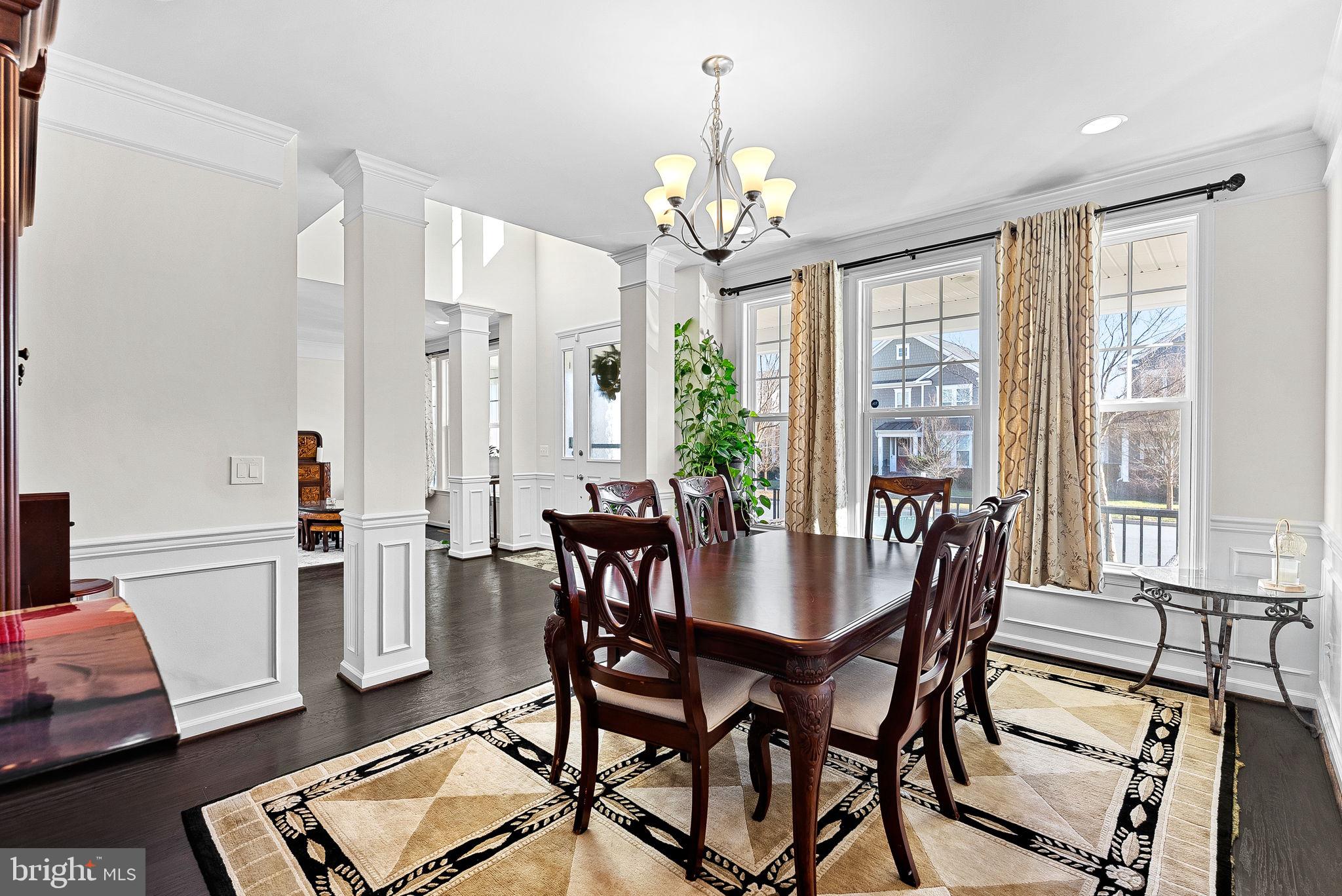 1010 Themis Street Southeast Leesburg, VA 20175 - Photo 14 of 64 a view of a dining room with furniture window and wooden floor