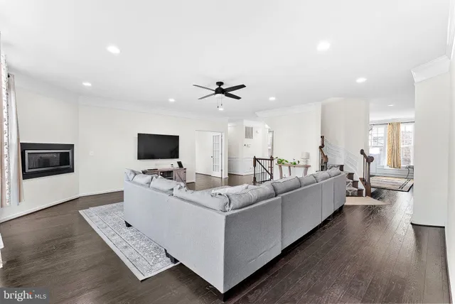 a kitchen with stainless steel appliances granite countertop a sink stove and wooden floor