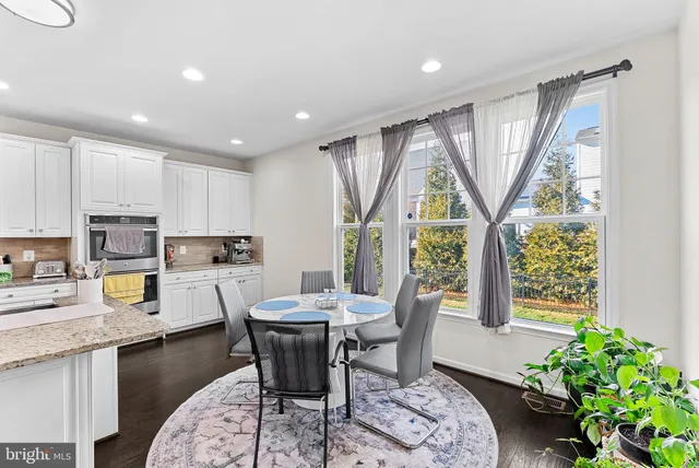 a bedroom with a bed and a television