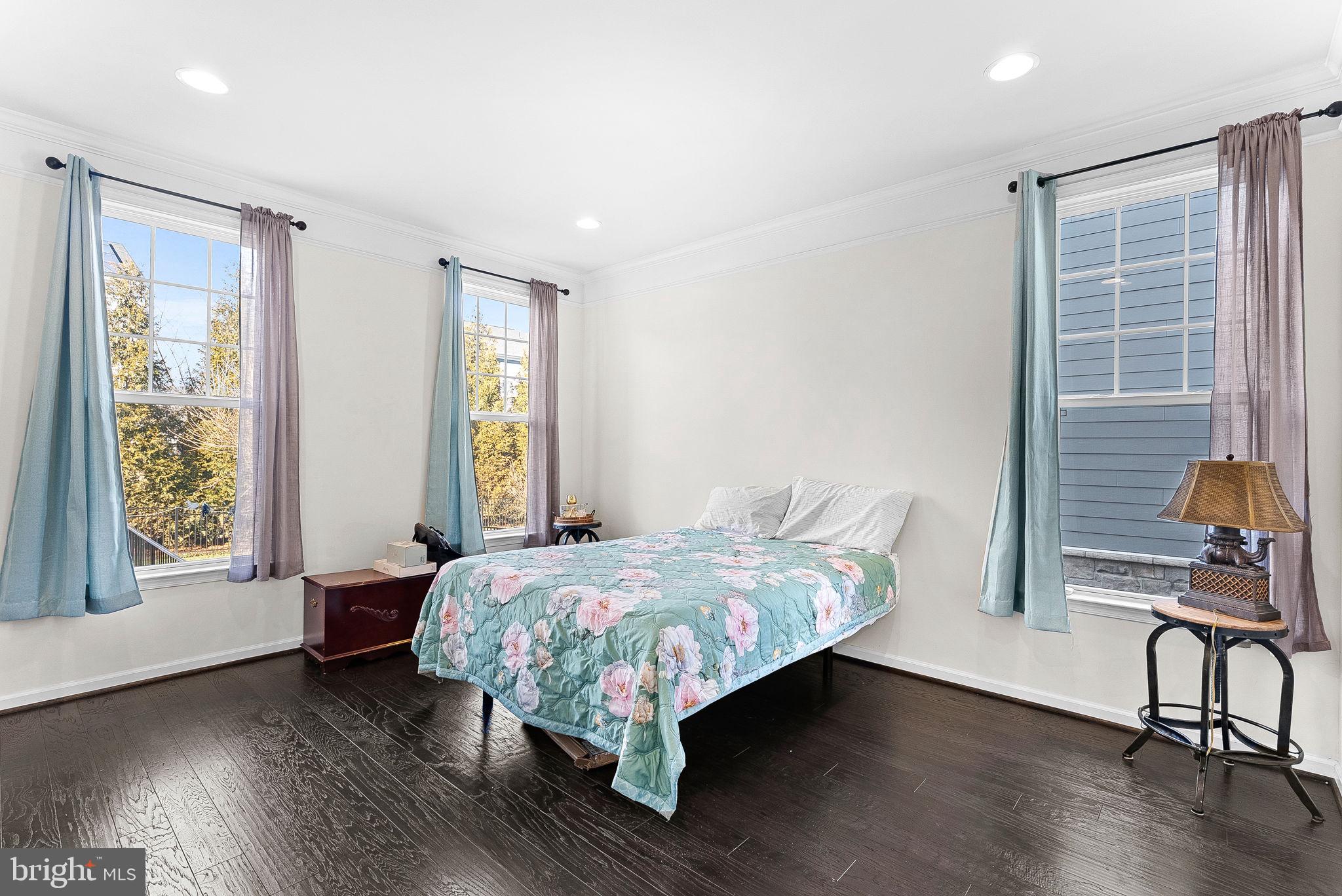 1010 Themis Street Southeast Leesburg, VA 20175 - Photo 27 of 64 a bed sitting in a bedroom next to a window