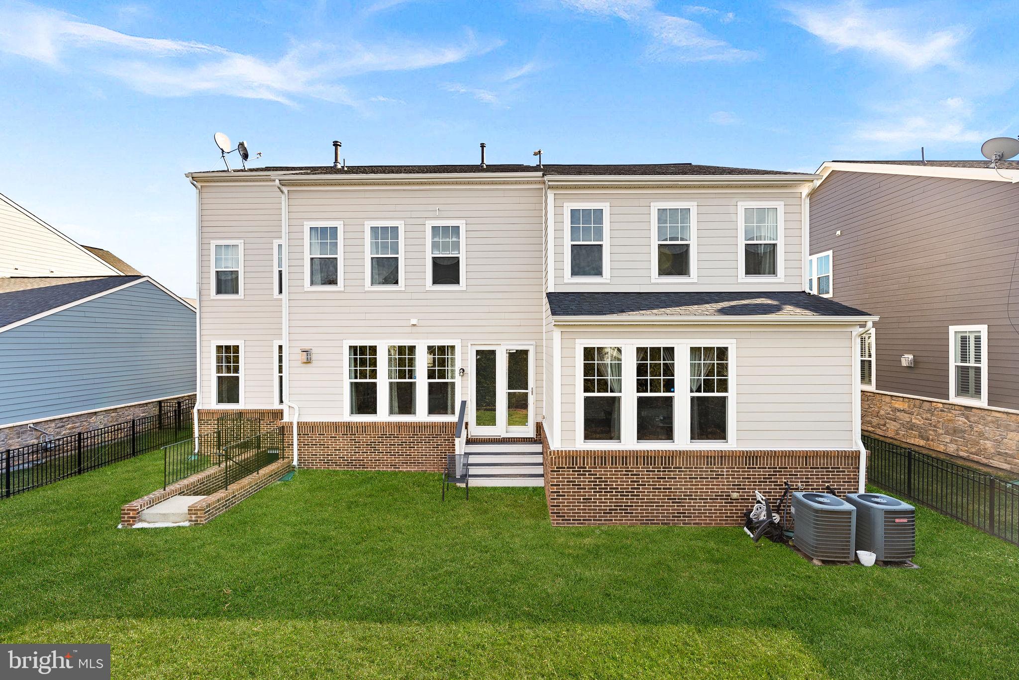1010 Themis Street Southeast Leesburg, VA 20175 - Photo 57 of 64 a front view of a house with a yard
