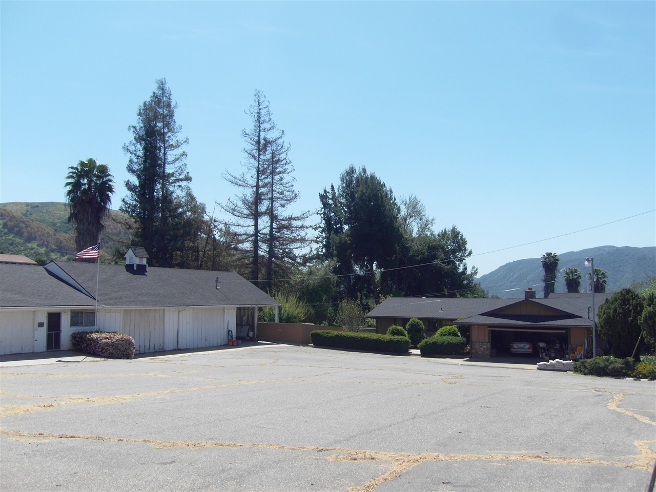 Main Home on the right 2356 sf, with 4150 sf Agricultiral mixed use building onleft