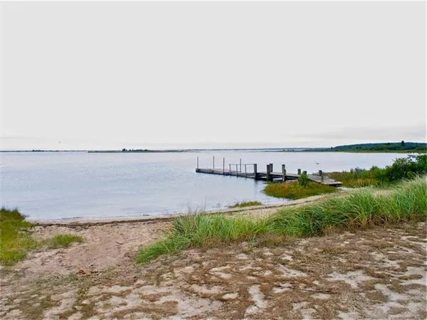 a view of a beach with a field